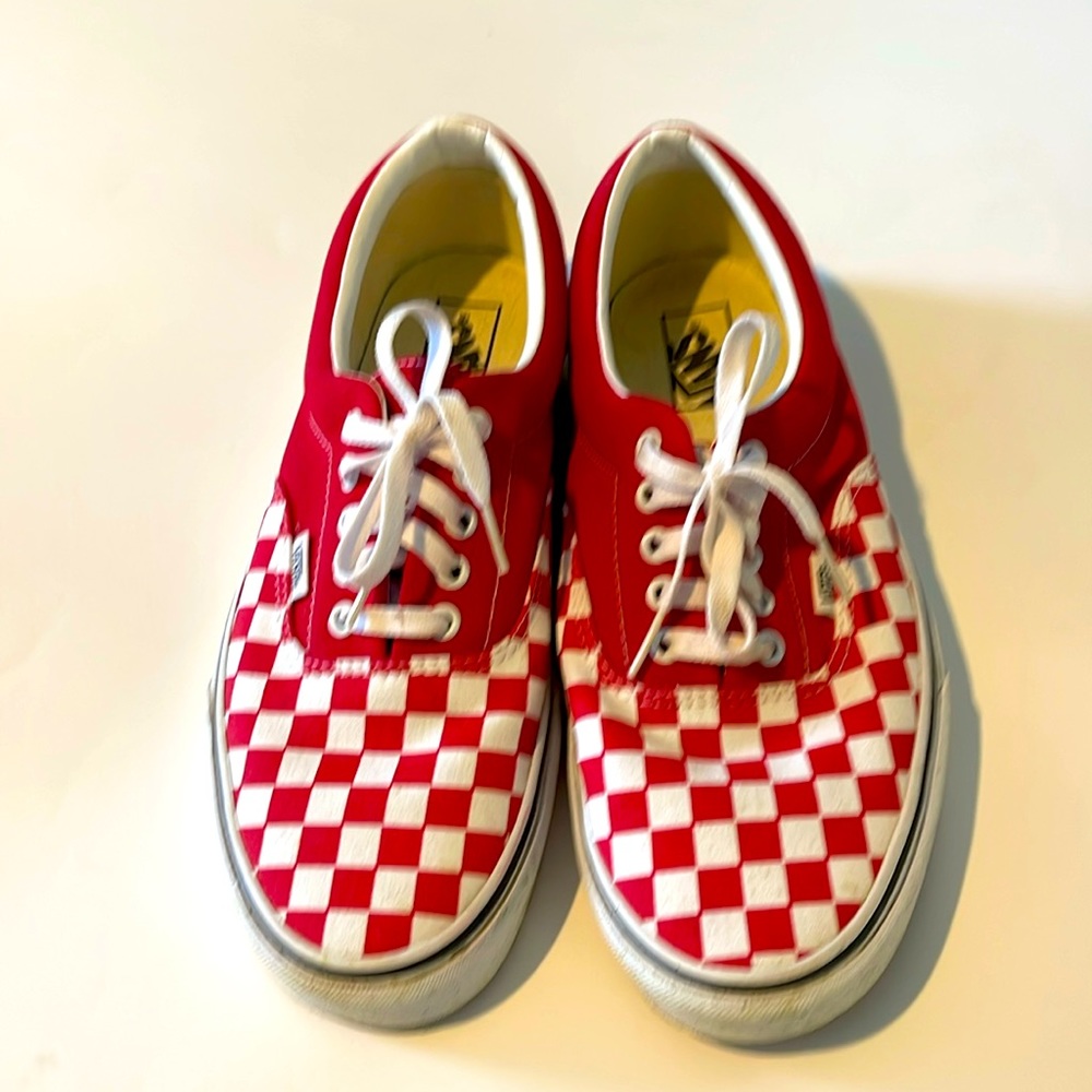 Never worn.  Men’s size 11 red and white checker Vans still in the box.